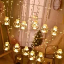 Guirlande lumineuse suspendue en forme de boule à rideau LED .